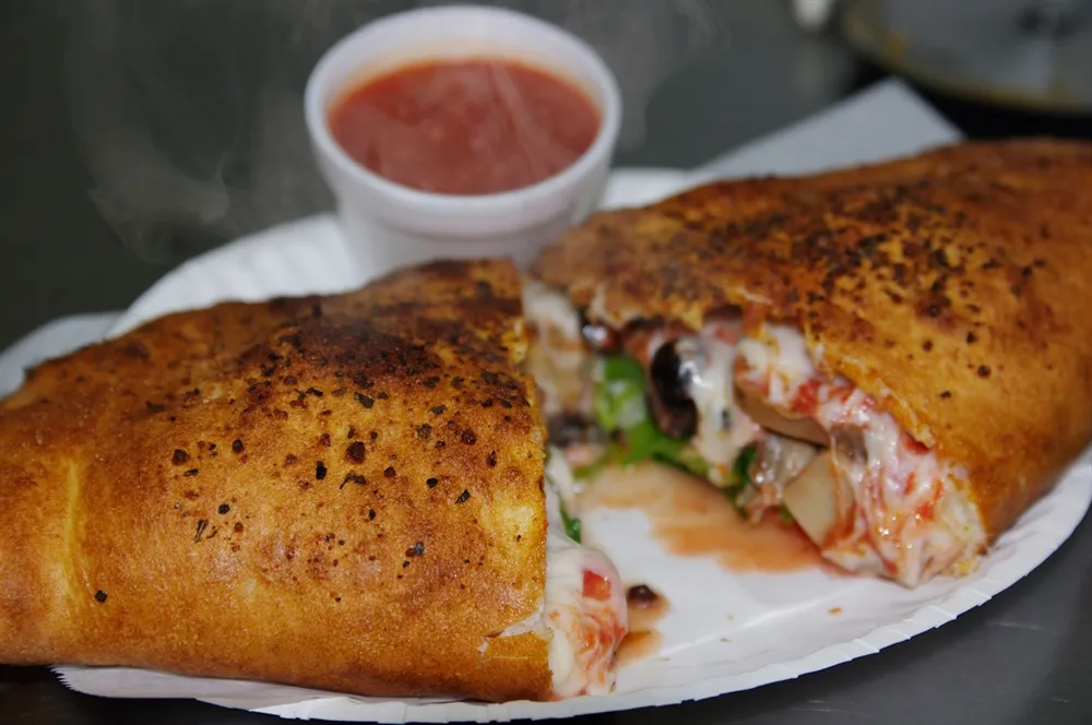 Steaming calzone with marinara