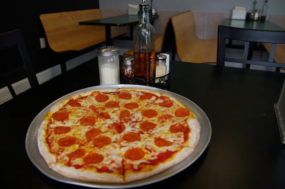 Pepperoni pie at the table